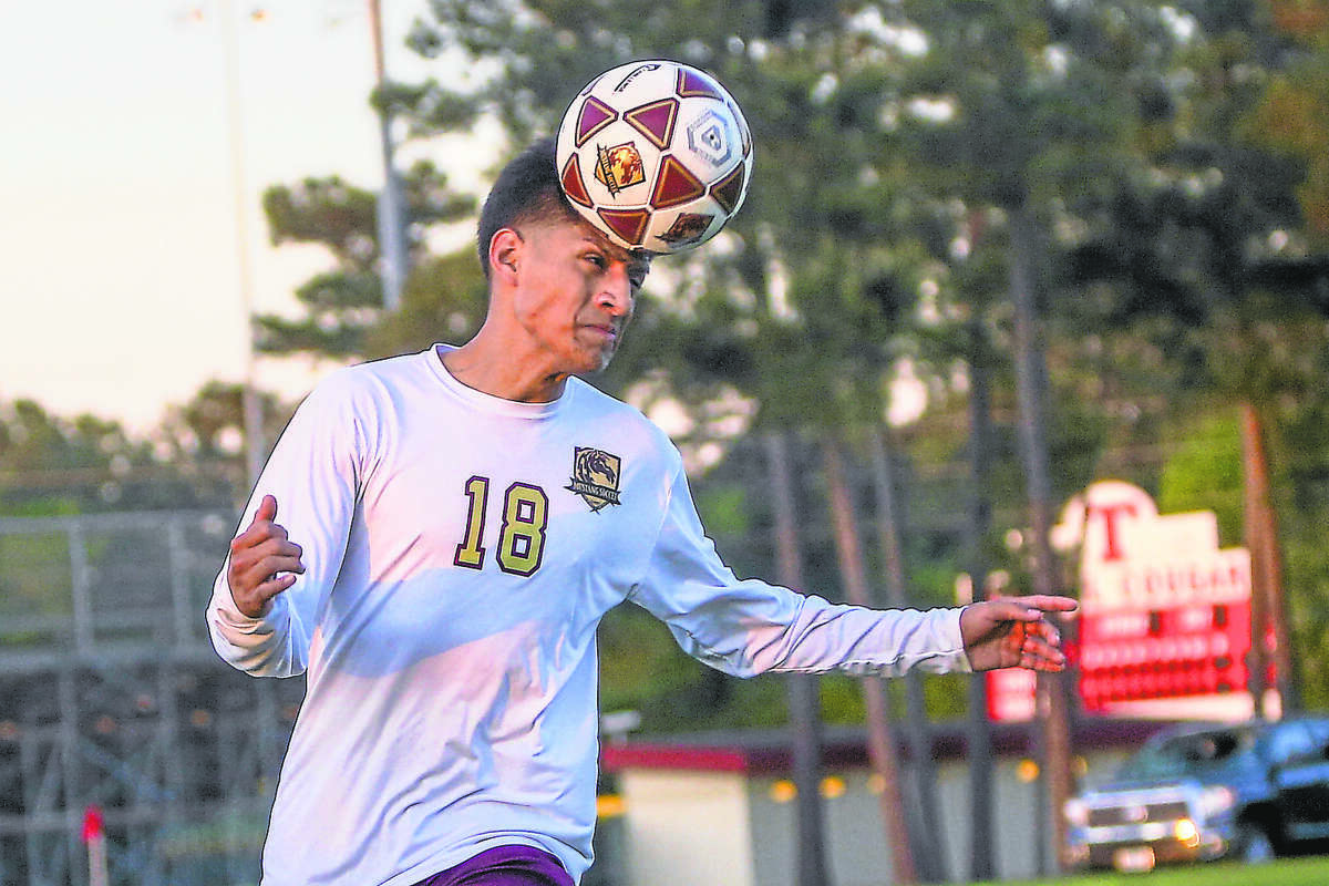 Magnolia West's Jonathan Gomez (18) heads the ball during the high school boys soccer game against Waller on Tuesday, April 5, 2016, at Tomball High School. To view more photos from the game, go to HCNPics.com.