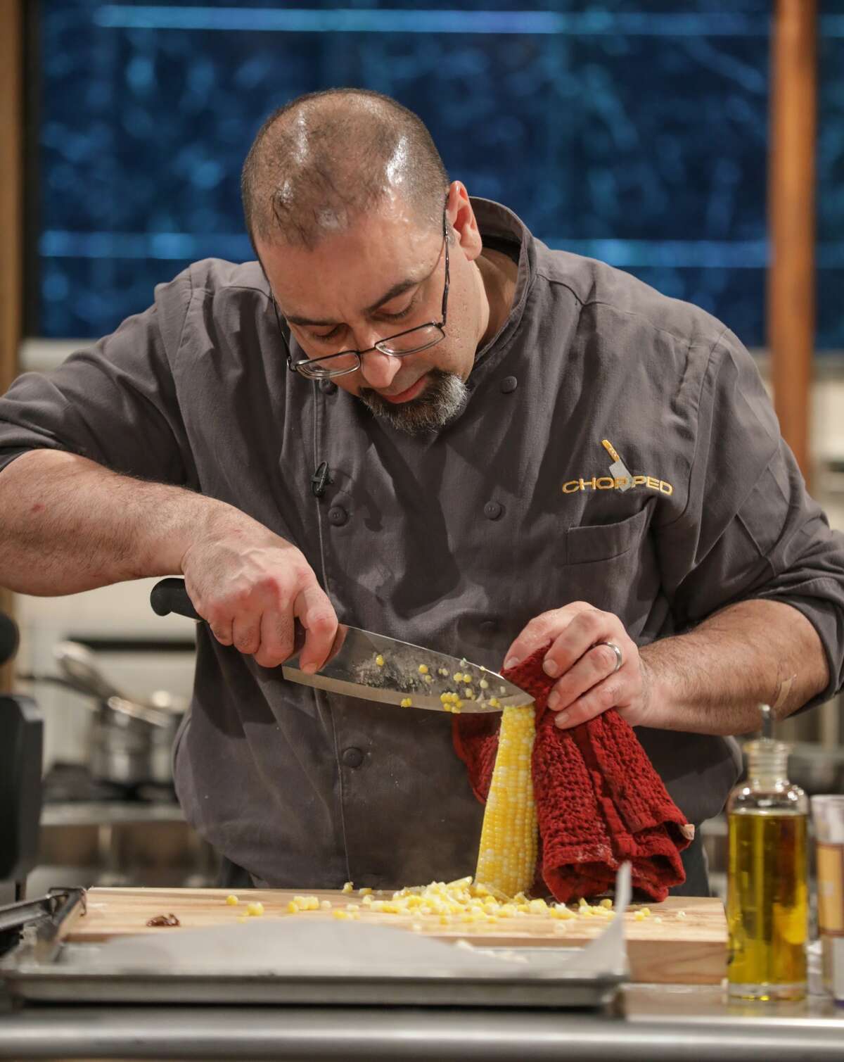 Stephen Costanzo, co-owner and head chef at Olio in Stamford prepares polenta on an episode of Food Network's "Chopped" that aired on Dec. 7, 2017. Costanzo won the competition.