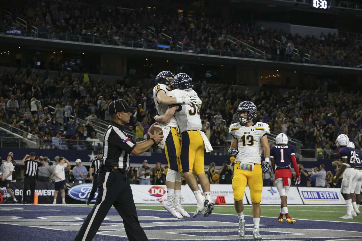 Dallas Highland Park players Carson Bryant (10) and Paxton Alexander (35) celebrate Alexander's touchdown during the second half of the Class 5A Division I State Championship Game at AT&T Stadium on Friday, Dec. 22, 2017, in Arlington. Manvel Mavericks lost to Dallas Highland Park Scots 53-49. ( Yi-Chin Lee / Houston Chronicle )