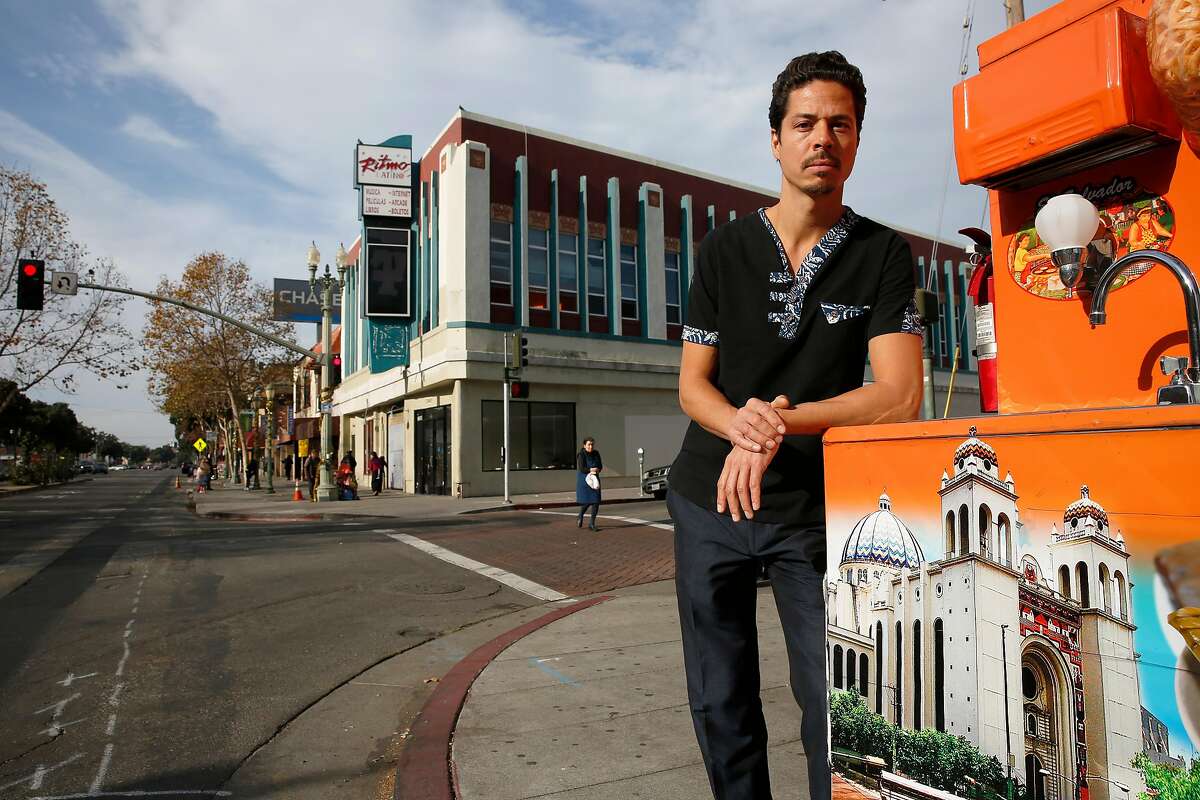 Liam Chinn, executive director of Restore Oakland with their newly acquired building behind him, on 34th Ave. and international Blvd. in Oakland, Ca., on Tuesday December 19, 2017. Restore Oakland is opening a community advocacy and training center in the heart of the Fruitvale neighborhood.