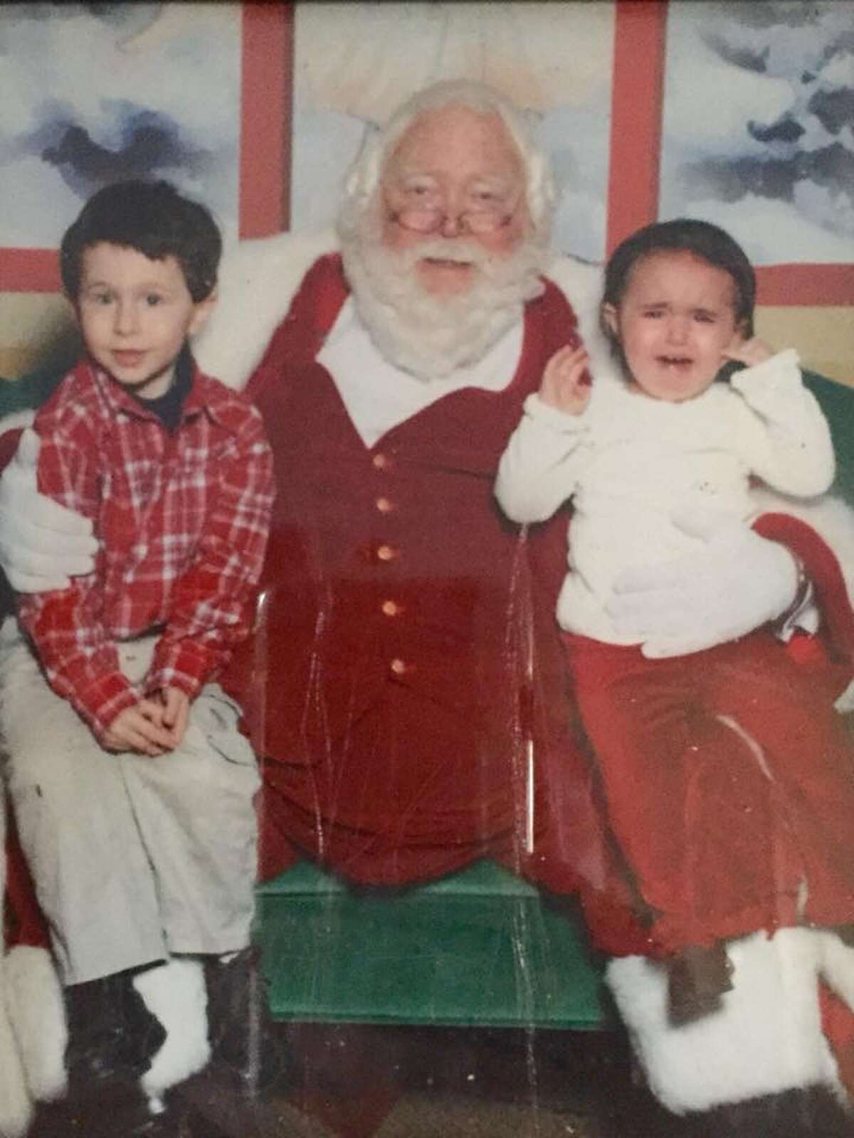 Daniel (left) and Emma (right) met Santa Claus 10 years ago in this memorable photo.