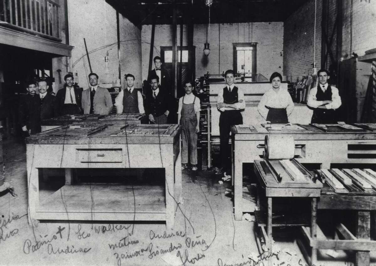 Jovita Idar (second from right) stands in the print shop of El Progreso, a newspaper she worked for in Laredo in the early 1900s. She was a rarity in what was then a male-dominated industry. The other newspaper employees are identified in handwriting on the photo, dated 1914. That year, she held off Texas Rangers who were trying to shut down the paper after it published an editorial critical of the U.S. invasion of Veracruz.