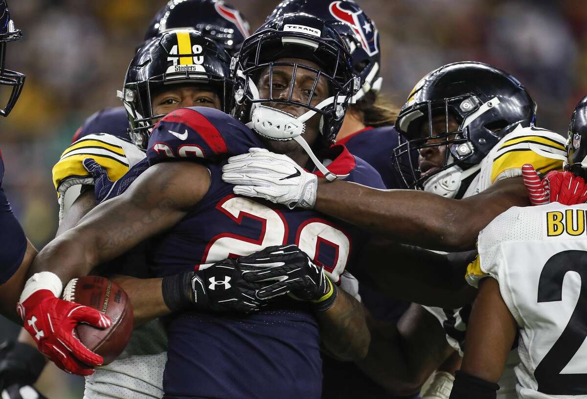 Houston Texans running back Alfred Blue (28) is stopped by the Pittsburgh Steelers defense on a run during the fourth quarter of an NFL football game at NRG Stadium on Monday, Dec. 25, 2017, in Houston. ( Brett Coomer / Houston Chronicle )