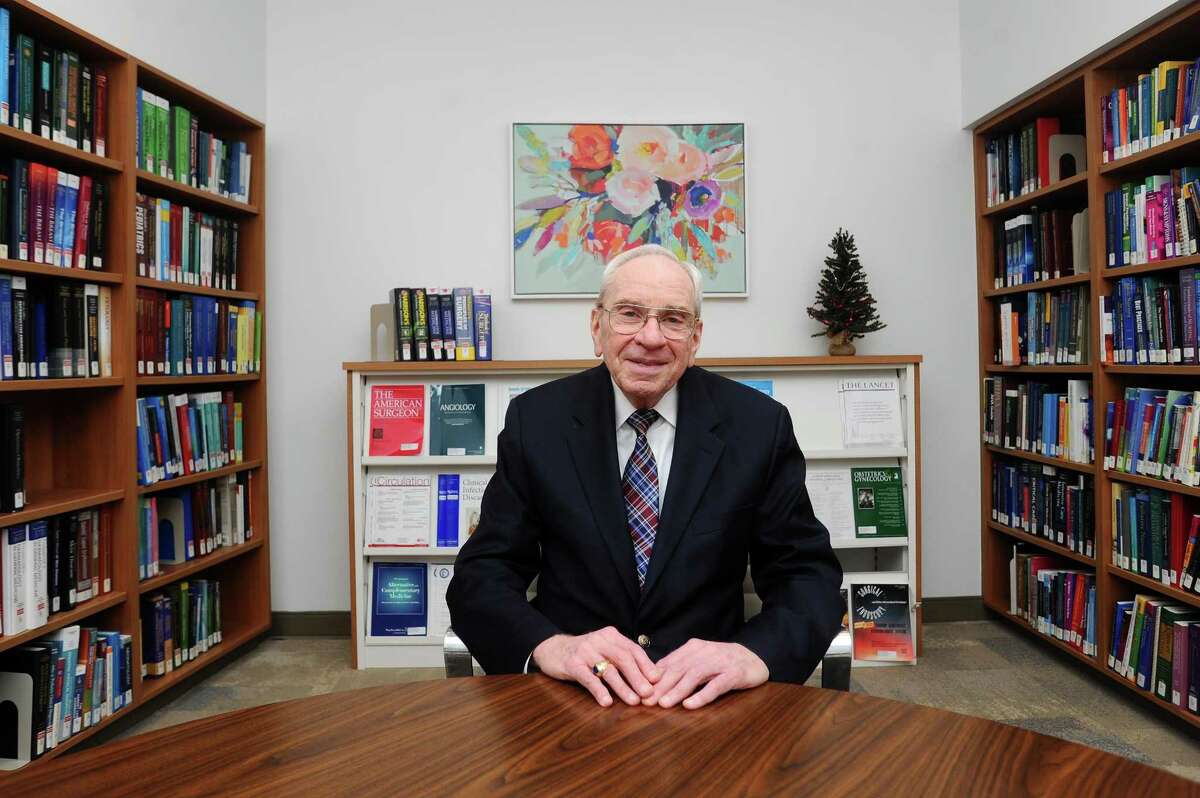 Dr. Noel Robin, chairman of the Department of Medicine at Stamford Hospital and a dean at Columbia University's College of Physicians and Surgeons, poses for a photo inside the library of the new Stamford Hospital in Stamford, Conn. on Tuesday, Dec. 19, 2017. Dr. Robin is retiring as the chairman at the end of the year but will continue to teach and see patients in the Stamford Hospital clinic.