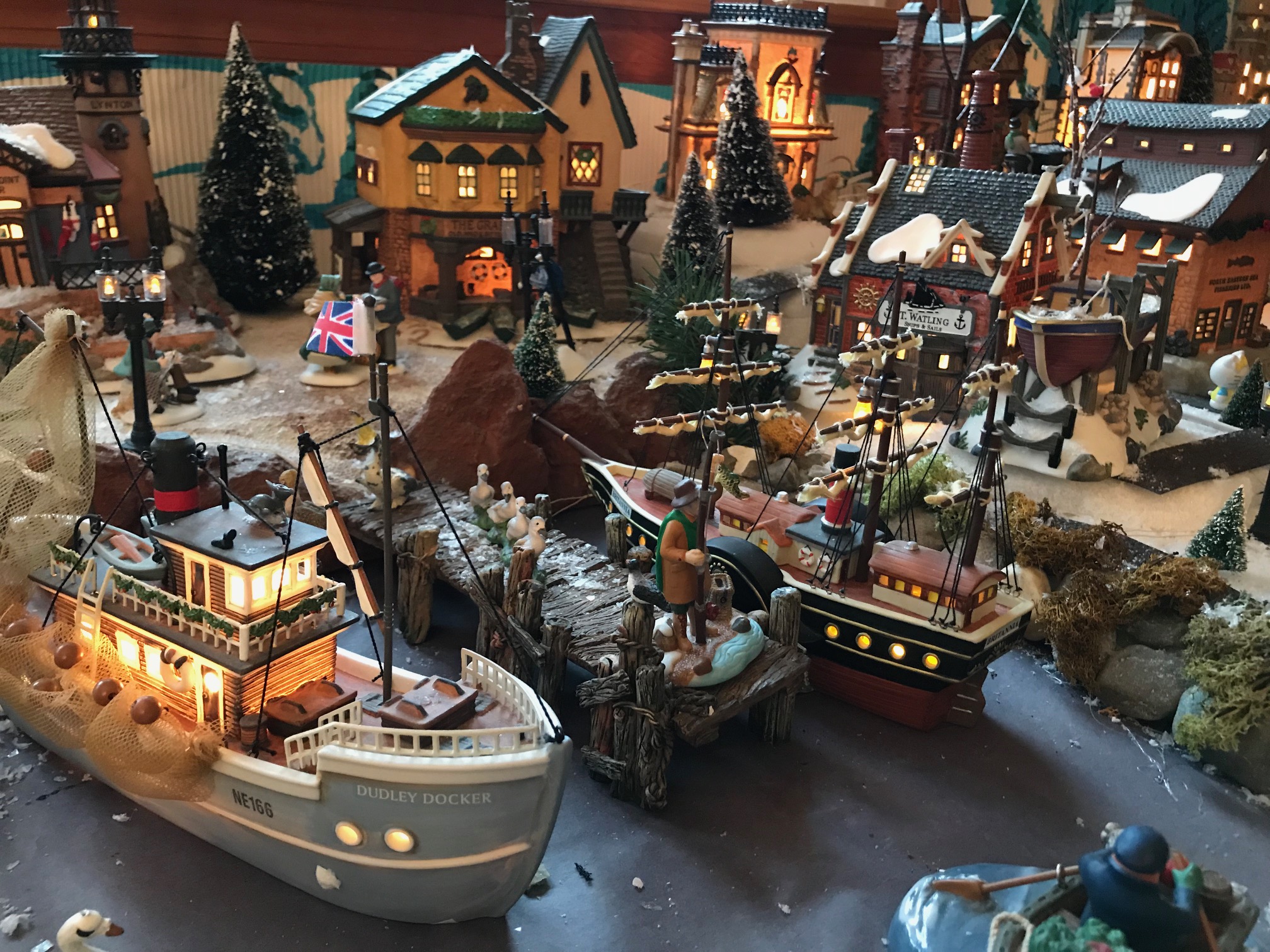 My neighbor's Dept 56 collection, two photos total. He ran out of room,  missing is his North Pole. : r/ChristmasVillages