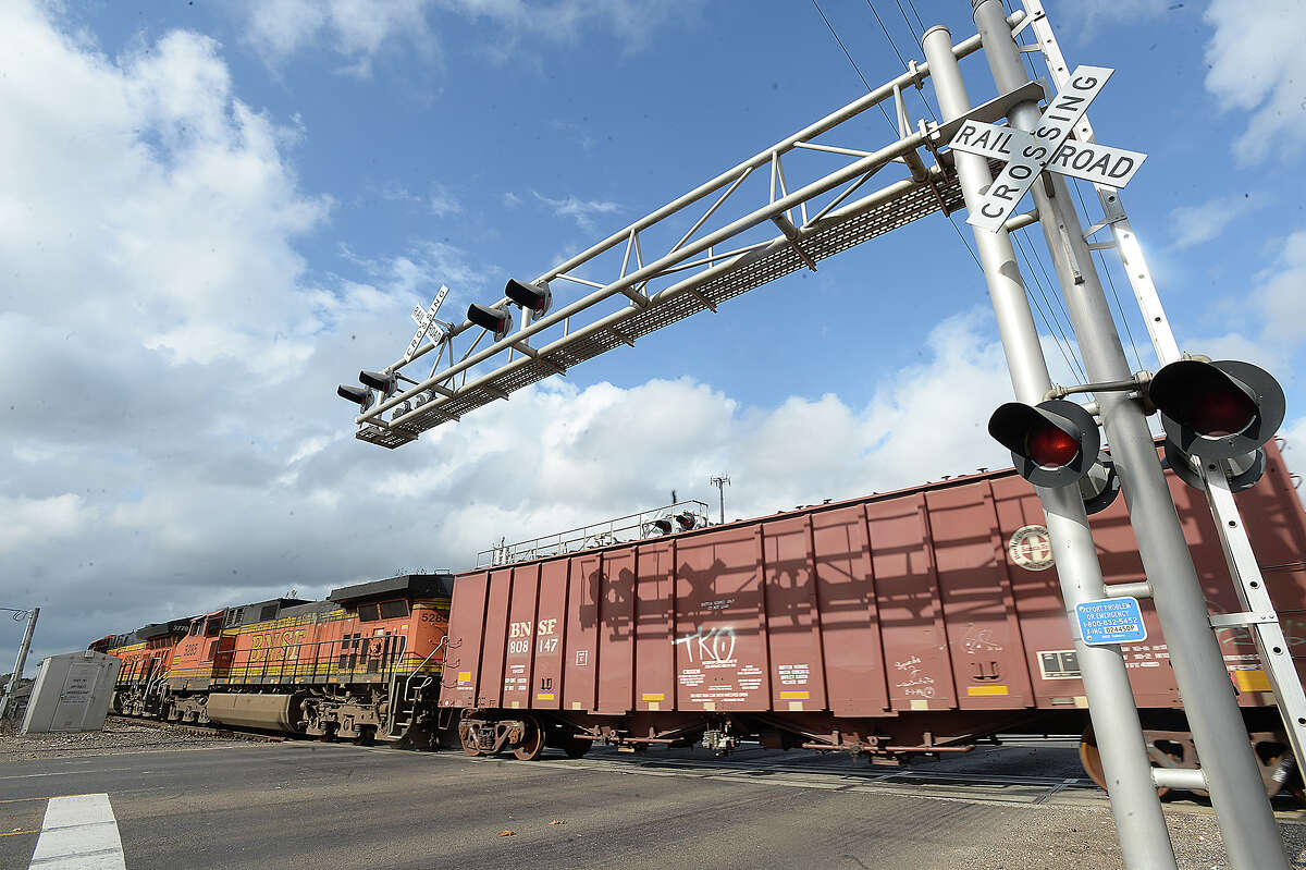 A freight train crosses Business 96 through downtown Silsbee Tuesday. Drivers often experience long delays as trains make their way through the switchyard, and business owners say it negatively impacts them both in noise and some unsafe driving as cars try to beat the train. Photo taken Tuesday, December 19, 2017 Kim Brent/The Enterprise