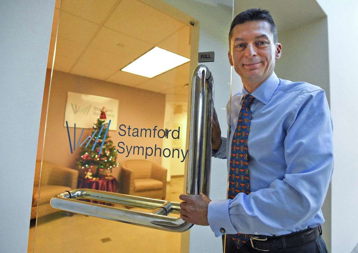 Russell Jones, new executive director of the Stamford Symphony, is photograph on Dec. 21, 2017 at the symphony offices in Stamford, Connecticut. He's a longtime orchestra administrator who moved from the United Kingdom over a decade ago and will be taking over for Barbara Soroca, who is retiring after 30-years.