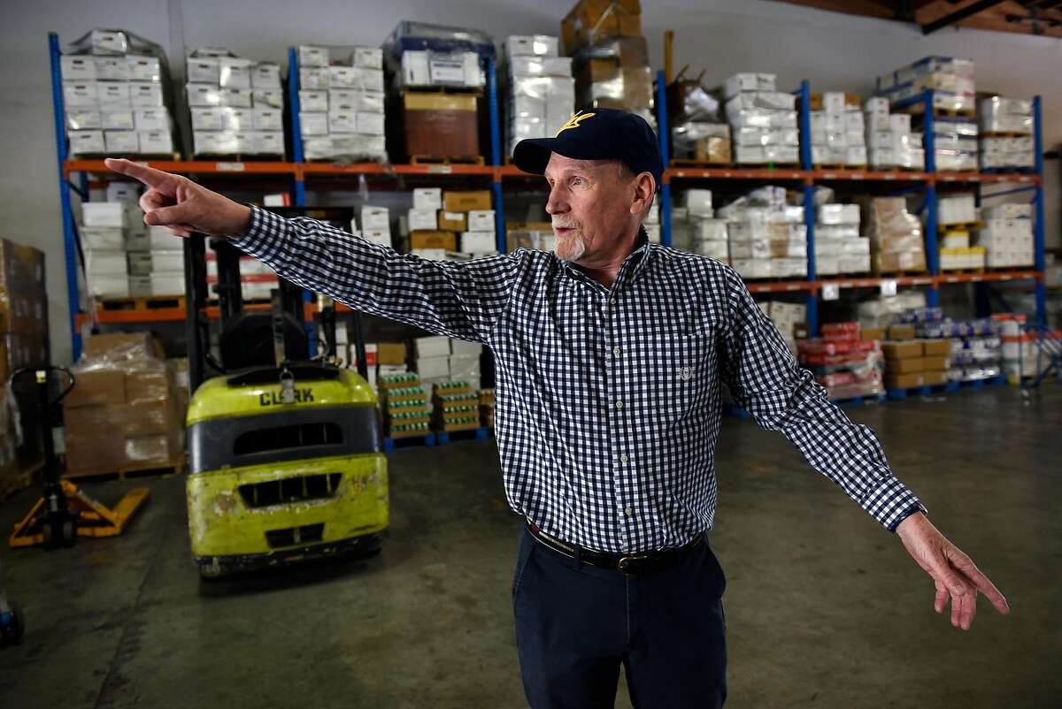 President Michael Hannigan talks about his company's operations at Give Something Back's warehouse in San Leandro, Calif., on Wednesday December 27, 2017.