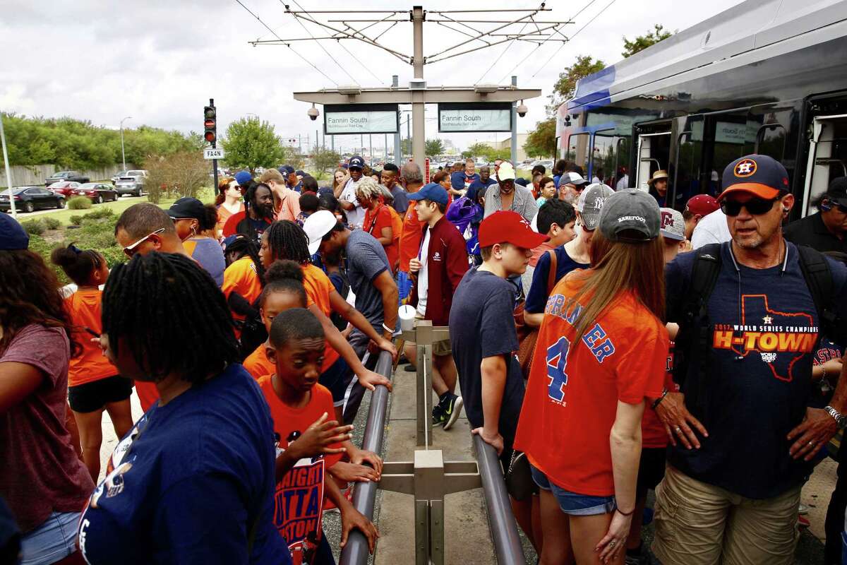 Hundreds of people wait in line to crowd onto trains at the Fannin South Transit Center hoping to ride the Metro Rail into downtown for the Astros World Series championship parade, Friday, Nov. 3, 2017. Trains started showing up at the station already full as riders began boarding the trains going southbound farther north on the line because they couldn't get on already full northbound trains. (Annie Mulligan / Houston Chronicle)