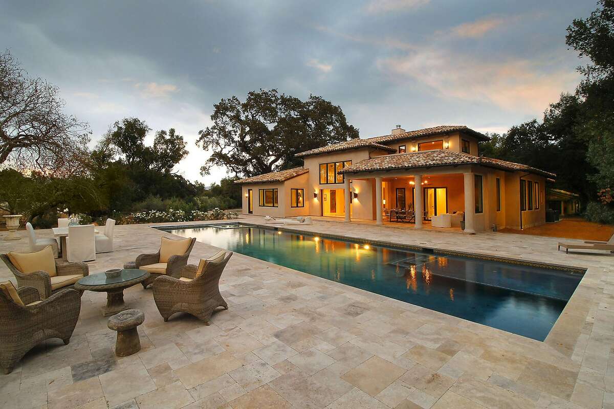 A tile terrace surrounds the 60-foot pool.