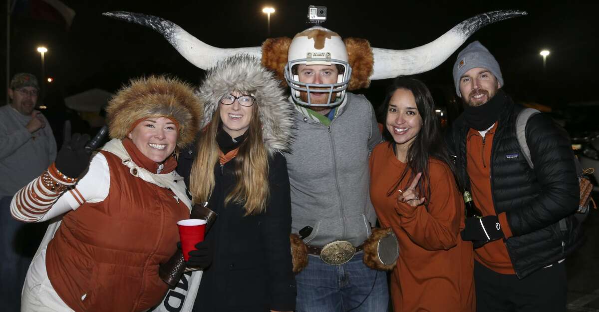 Texas and Missouri fans pose for a photo before the 2017 Academy Sports + Outdoors Texas Bowl at NRG Stadium on Wednesday, Dec. 27, 2017, in Houston. ( Yi-Chin Lee / Houston Chronicle )