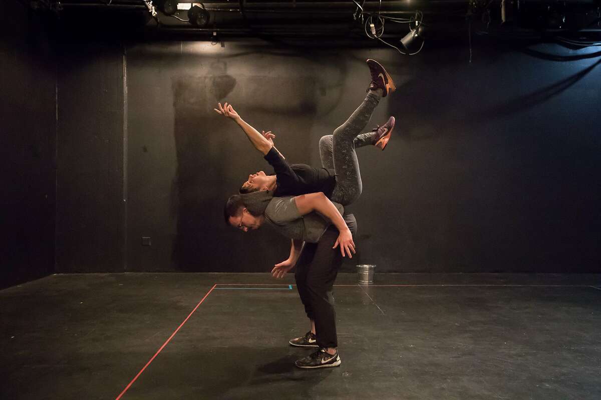 Soren Santos (bottom) and Stephanie DeMott rehearsing in Mugwumpin's "In Event of Moon Disaster." on Tuesday, Dec. 19, 2017 in San Francisco, Calif.
