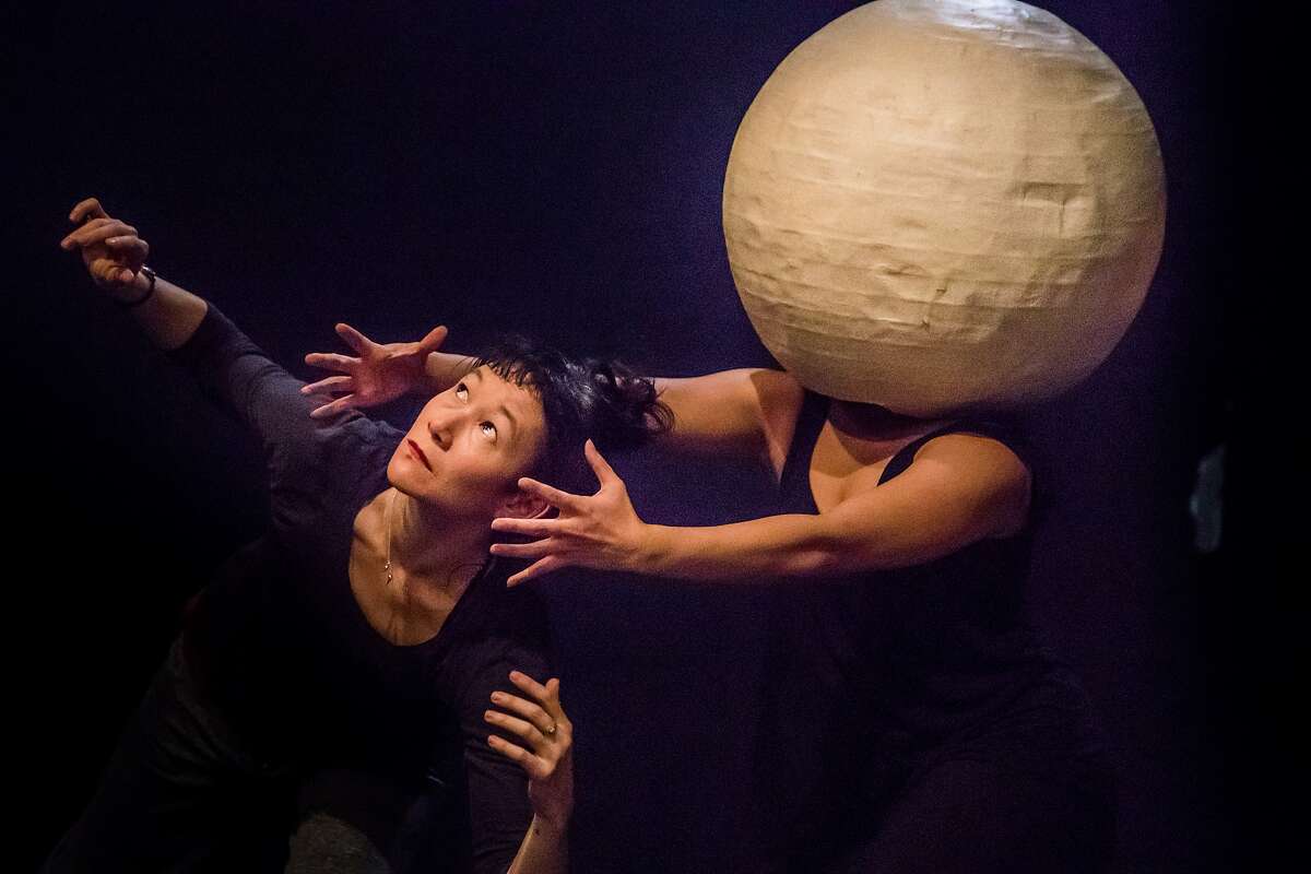 Erin Mei-Ling Stuart and Isa Musni (in moon) rehearse in Mugwumpin's "In Event of Moon Disaster." on Tuesday, Dec. 19, 2017 in San Francisco, Calif.