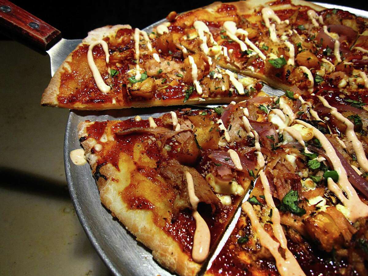 The Pit Pig pizza comes with pork and grilled pineapple at Francis Bogside.