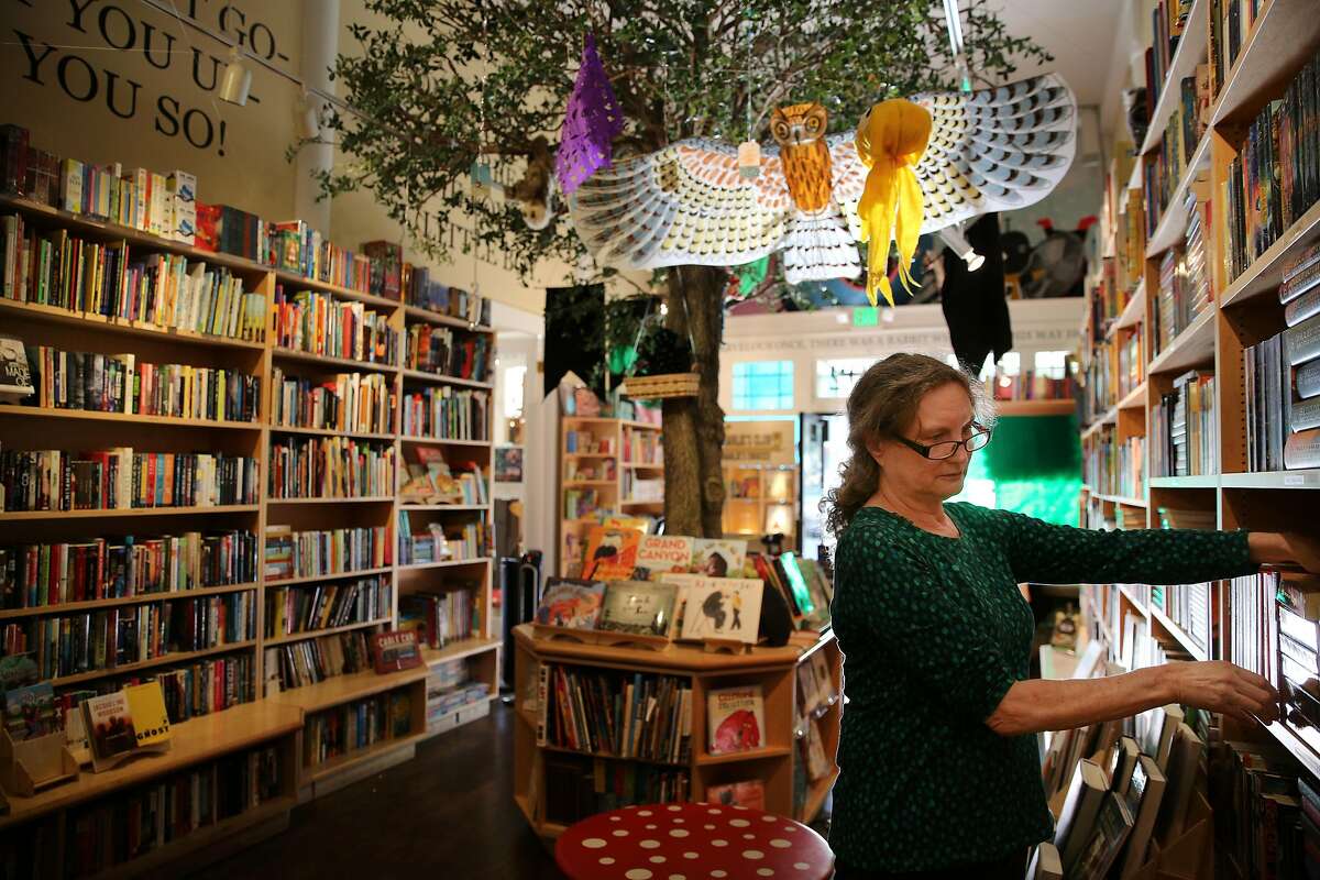Katharine Wright organizes books at Charlie's Corner bookstore on Tuesday, Nov. 28, 2017, in San Francisco, Calif.