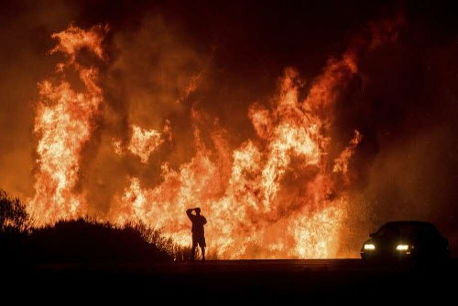 2) Thomas Fire, Ventura and Santa Barbara counties, Dec. 2017

Size: 281,893 acres, 440 square miles; half the size of Marin County, twice the size of Chicago and nine and a half times the size of San Francisco
(Photo: In this Dec. 6, 2017, file photo, a motorists on Highway 101 watches flames from the Thomas fire leap above the roadway north of Ventura, Calif.) Photo: Noah Berger, Associated Press