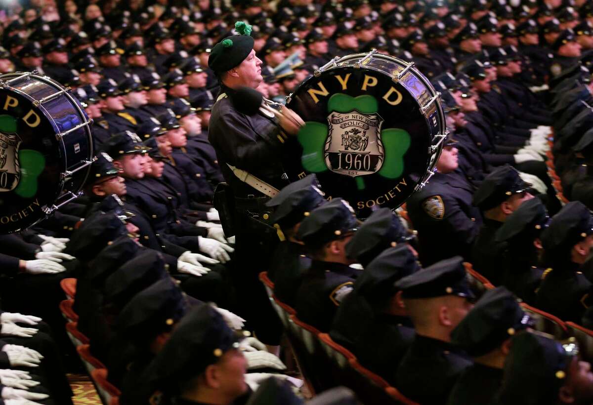 A pipe and drum band performs during a Police Academy graduation ceremony at the Beacon Theatre in New York, Thursday, Dec. 28, 2017. The new recruits will join approximately 36,000 other police officers on the largest police force in the United States. (AP Photo/Seth Wenig)