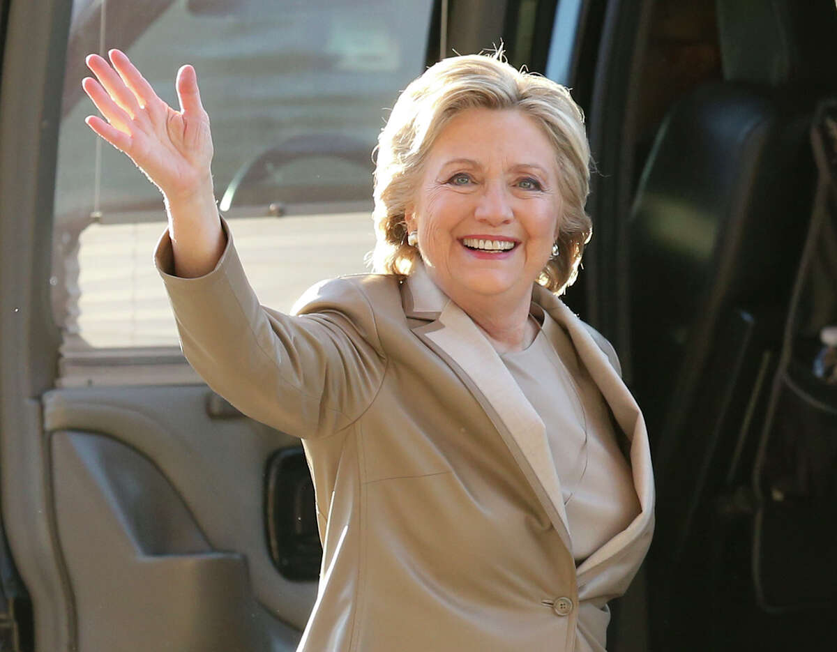 FILE - In this Nov. 8, 2016 file photo, Democratic presidential candidate Hillary Clinton waves as she arrives to vote at her polling place in Chappaqua, N.Y. Vanity Fair is trying to defuse criticism of a video mocking Clinton and her presidential aspirations. In a statement Wednesday, Dec. 27, 2017, the magazine said the online video was an attempt at humor that regrettably "missed the mark." (AP Photo/Seth Wenig, File)