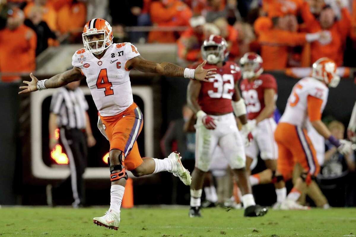 TAMPA, FL - JANUARY 09: Quarterback Deshaun Watson #4 of the Clemson Tigers celebrates after throwing a 2-yard game-winning touchdown pass during the fourth quarter against the Alabama Crimson Tide to win the 2017 College Football Playoff National Championship Game 35-31 at Raymond James Stadium on January 9, 2017 in Tampa, Florida. (Photo by Streeter Lecka/Getty Images) ORG XMIT: 686857421