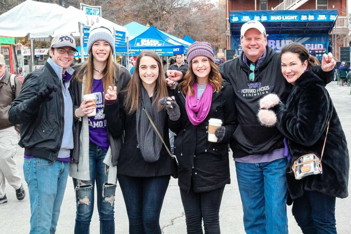 Cold weather didn't deter dueling TCU and Stanford fans attending pre-Alamo Bowl festivities at Sunset Station on Thursday, Dec. 28, 2017. The Valero Alamo Bowl fan zone offered games, food trucks and music as attendees waited for kick-off