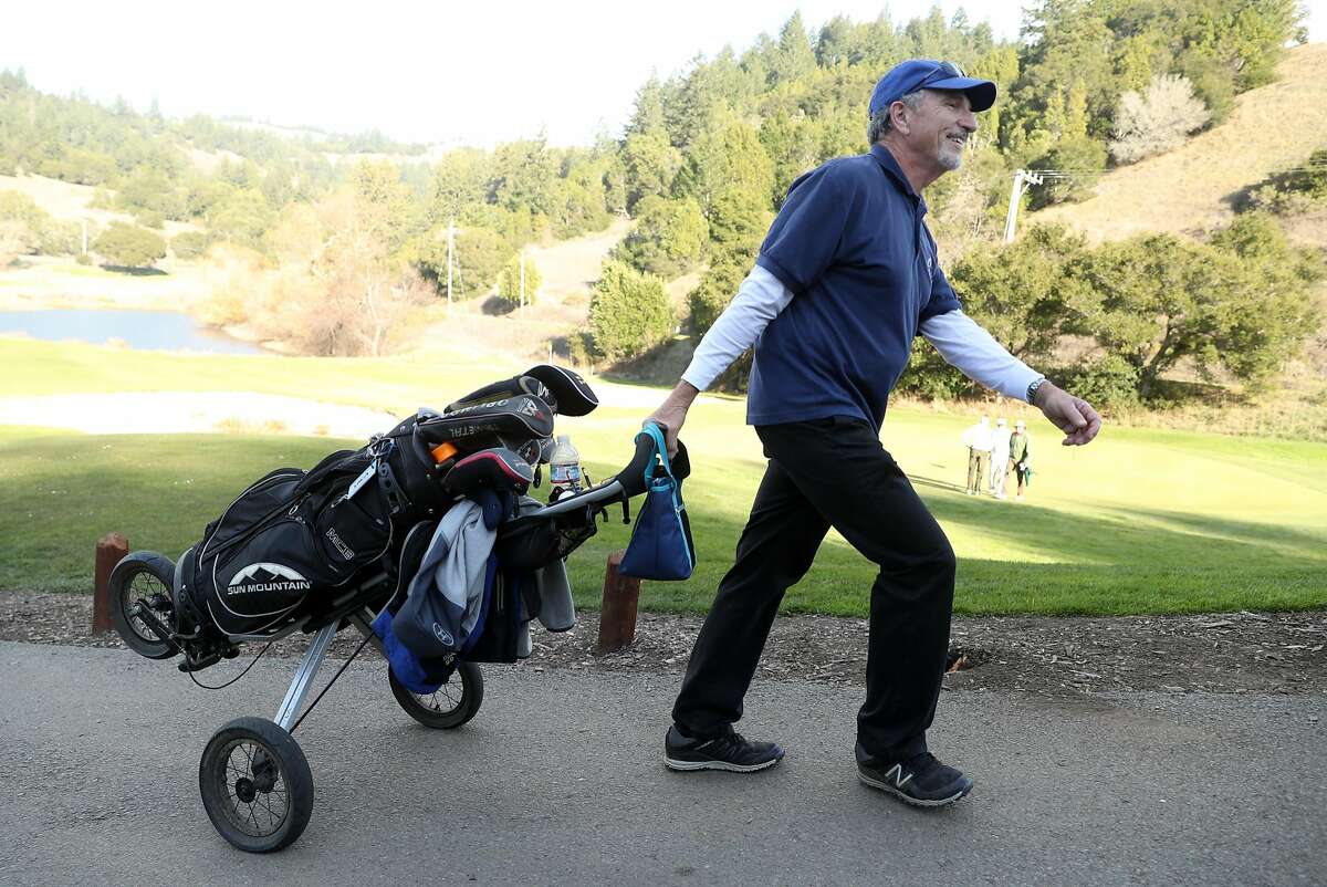 Tom Faimali of San Rafael leaves the 18th green after completing his round at San Geronimo Golf Course in San Geronimo, Calif., on Monday, December 18, 2017.