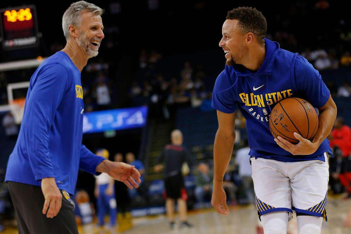 From left: Golden State Warriors assistant coach Bruce Fraser and Stephen Curry (30) before an NBA game between the Golden State Warriors and Toronto Raptors at Oracle Arena on Wednesday, Oct. 25, 2017, in Oakland, Calif.