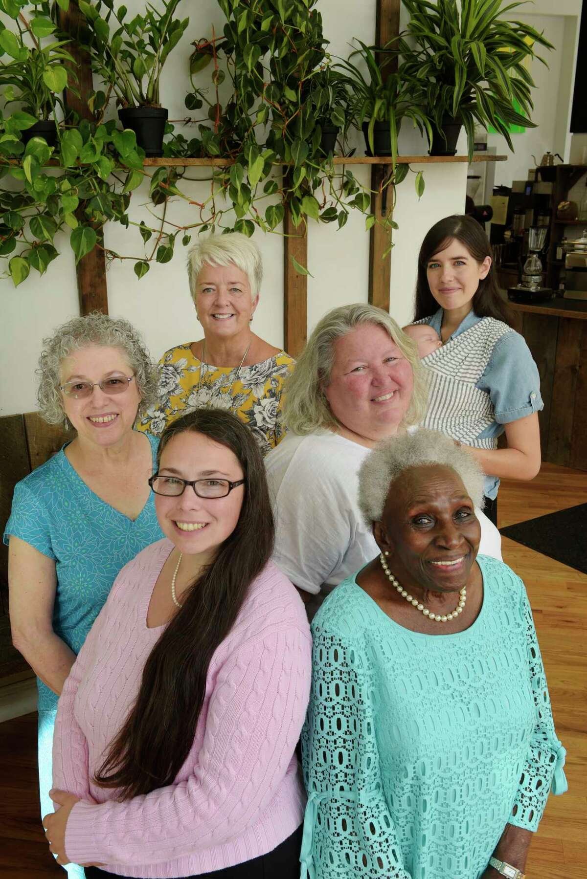 Danielle Sanzone, front left, Ada Kinsey, front right, Cecile Kowalski, middle left, Mary Beth Clancy-Halayko, middle right, Megan O'Toole, background left, and Caroline Corrigan with her son, Graham Watkins pose for a photo on Thursday, Sept. 28, 2017, at Stacks Espresso Bar in Albany, N.Y. (Paul Buckowski / Times Union)