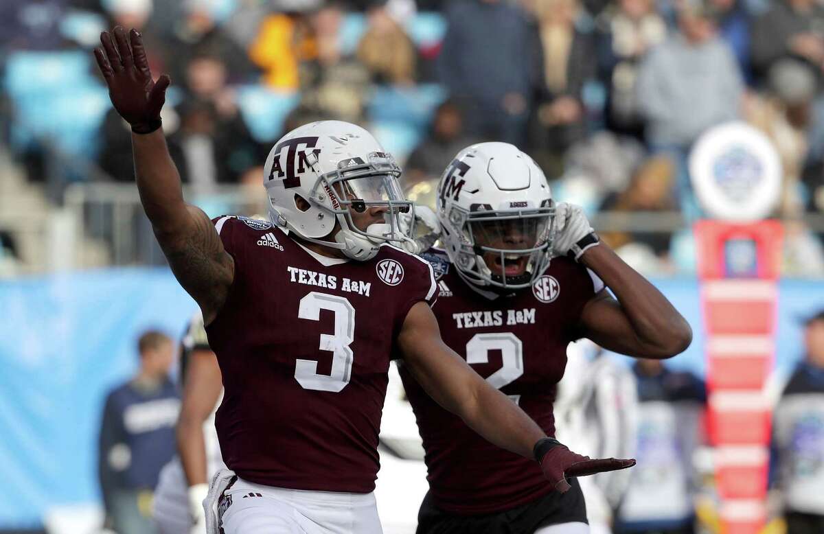 CHARLOTTE, NC - DECEMBER 29: Christian Kirk #3 celebrates after scoring a touchdown with teammate Jhamon Ausbon #2 of the Texas A&M Aggies against the Wake Forest Demon Deacons during the Belk Bowl at Bank of America Stadium on December 29, 2017 in Charlotte, North Carolina.