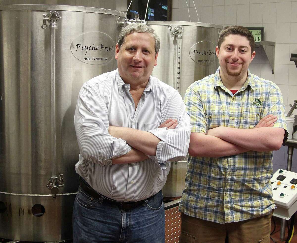 Jim and David Baulsir of Redding Beer Company stand by the three-barrel brewing system at their new brewery  in Redding, Conn., on Wednesday, Sept. 27, 2017.