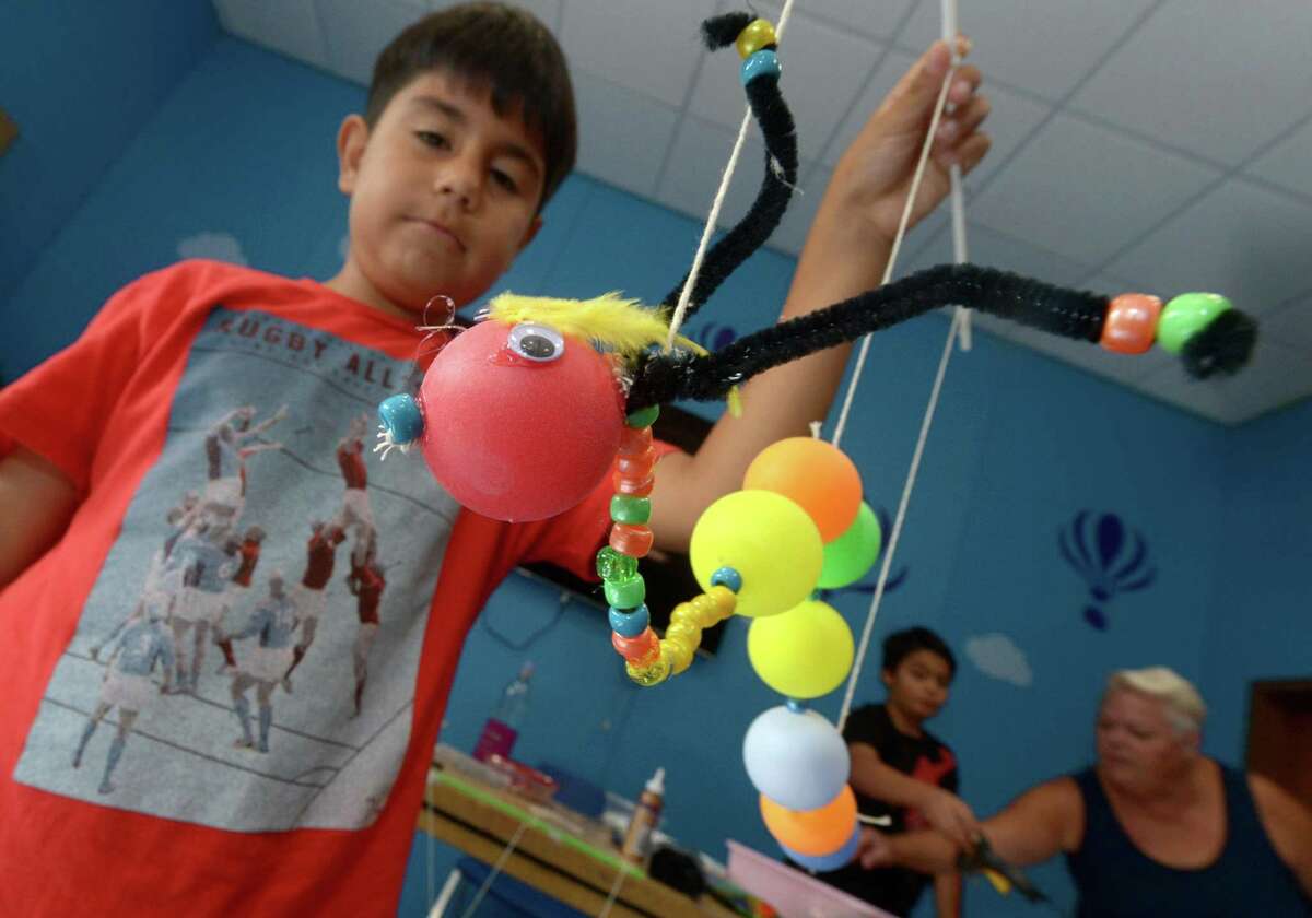 Luis Palomeque, 10, makes caterpillar mariontette during a five-day puppet workshop at the Norwalk Public Library main branch. Don’t miss a chance to learn about all that the Norwalk Public Library has to offer when it hosts an Open House from 1-5 p.m. on Jan. 7 at the Main Library, 1 Belden Ave.