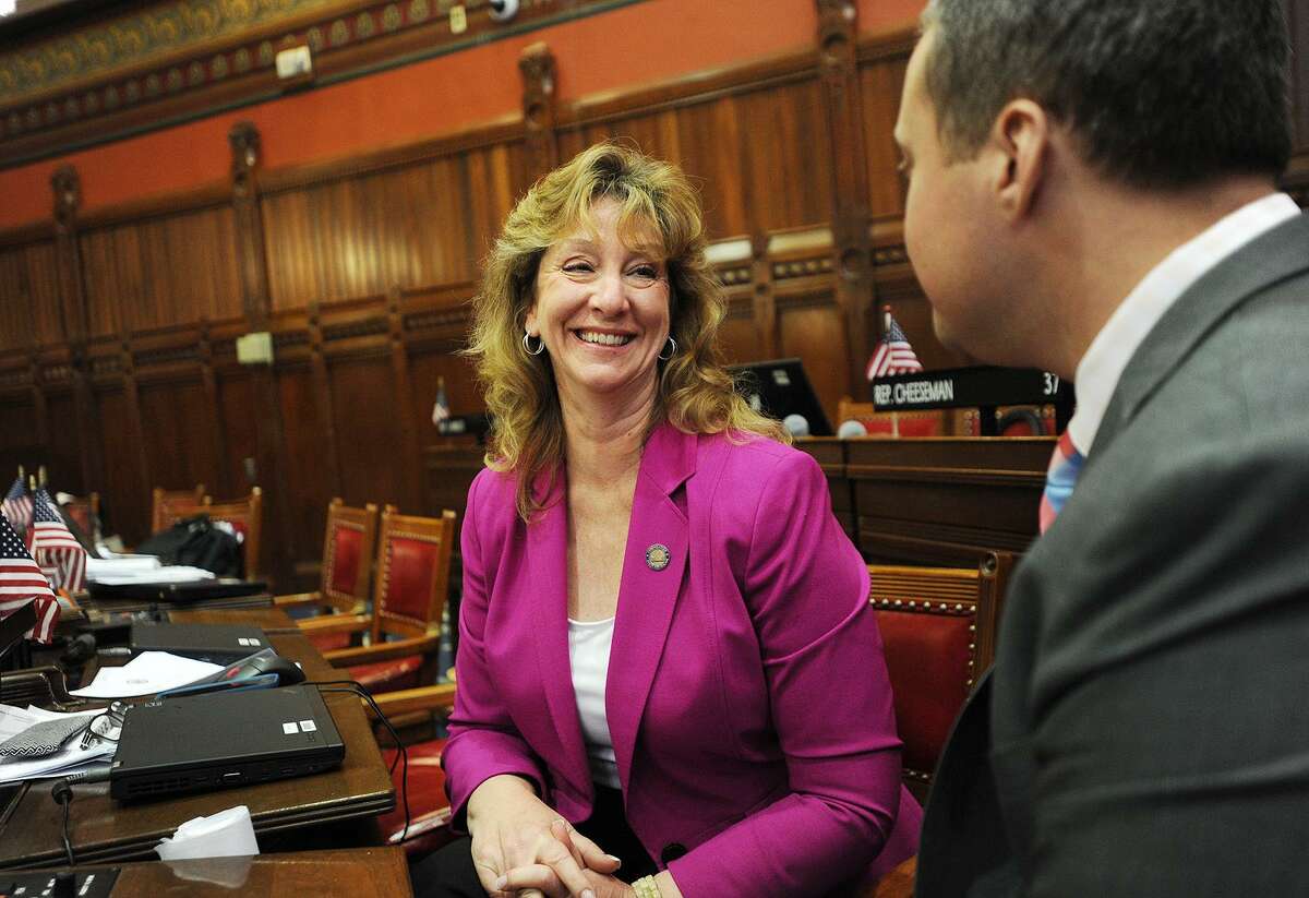 Rep. Laura Hoydick, R- Stratford, left, talks with Rep. J.P. Sredzinski, R-Monroe/Newtown, in the House chambers at the Capitol in Hartford in June 1. Now Mayor of Stratford, Hoydick, fulfilling a campaign promise, announced Friday afternoon that she’ll resign her 120th District House seat on Jan. 2.