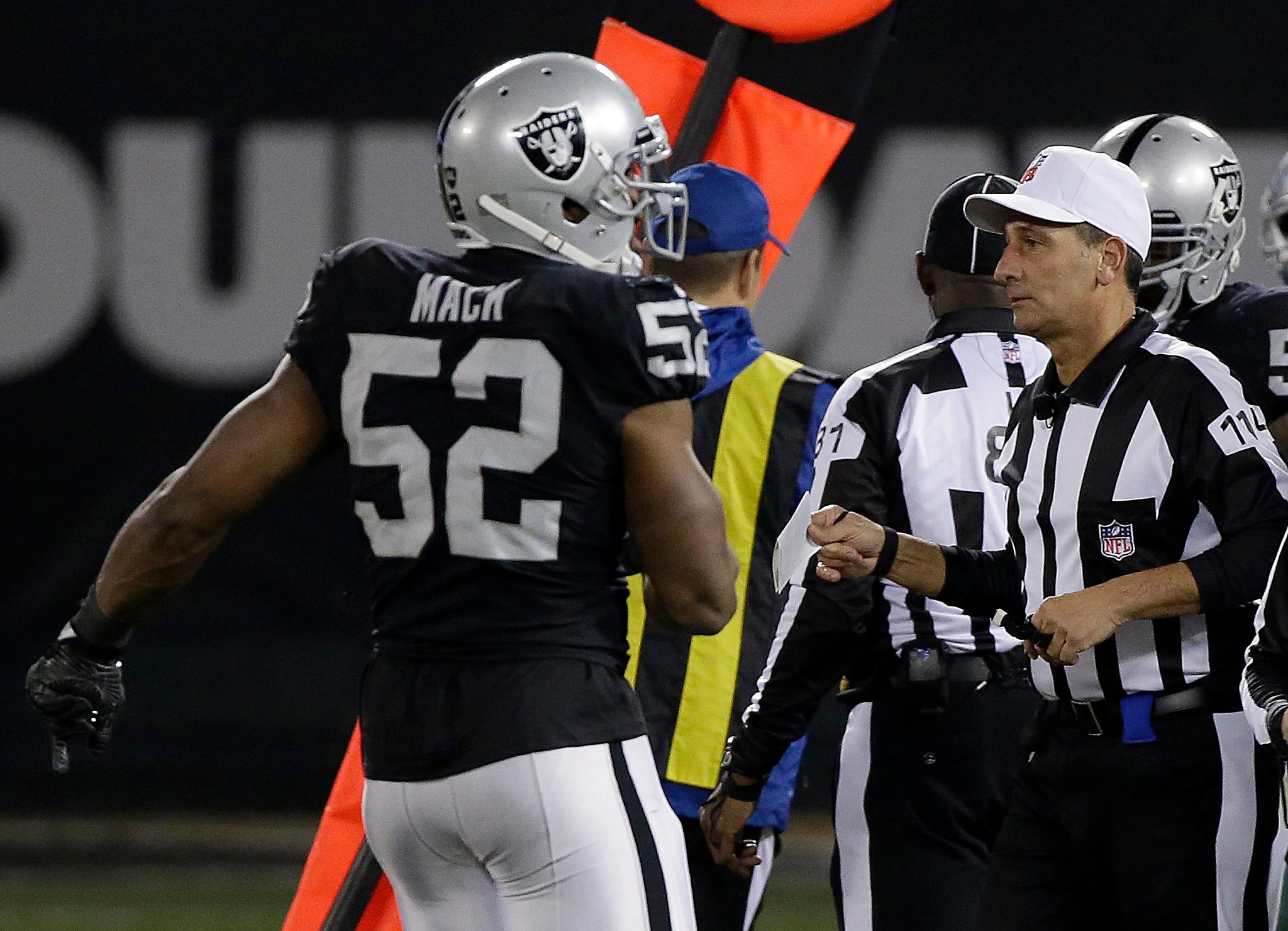 Oakland Raiders quarterback Derek Carr (4) celebrates with defensive end  Khalil Mack (52) during the second half of an NFL football game against the  Buffalo Bills in Oakland, Calif., Sunday, Dec. …