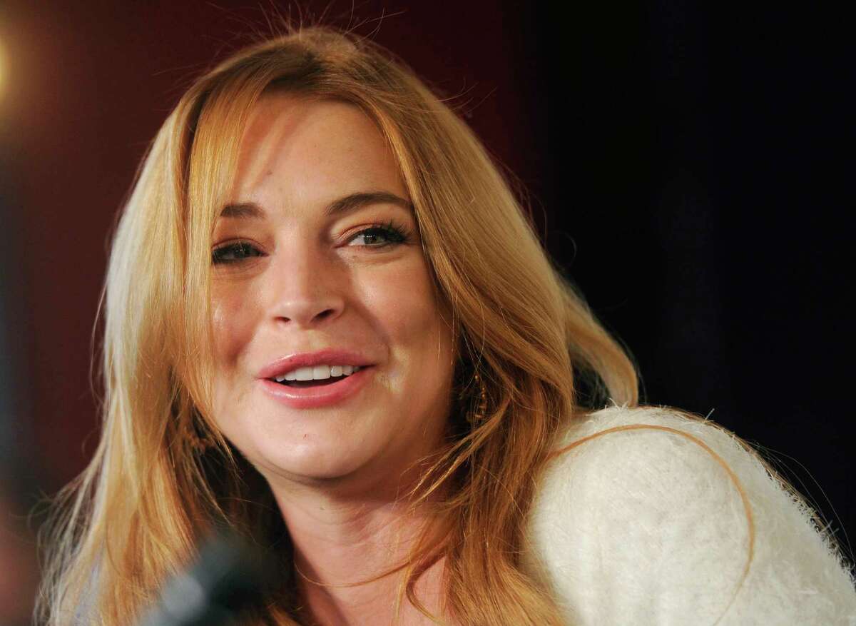 FILE - In this Jan. 20, 2014 file photo, actress Lindsay Lohan addresses reporters during a news conference at the 2014 Sundance Film Festival in Park City, Utah. Lohan says she suffered a miscarriage during the taping of Sunday?’s final episode of her OWN cable channel reality TV series, ?“Lindsay." (Photo by Chris Pizzello/Invision/AP, File) ORG XMIT: NY108