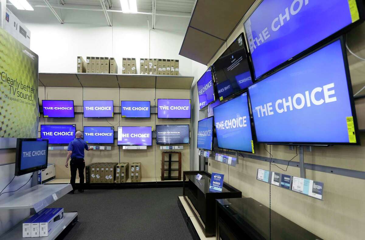 This Tuesday, May 23, 2017, photo shows televisions on display at a Best Buy in Cary, N.C. If you are shopping for a new flat-screen TV or dresser for the baby?’s room this holiday season, factoring in safety concerns can save you some trouble. Federal safety regulators recommend anchoring TVs and dressers to the wall to prevent them from tipping over, especially with small children around. Planning for that could influence which product you choose and where to put it in your home. (AP Photo/Gerry Broome)