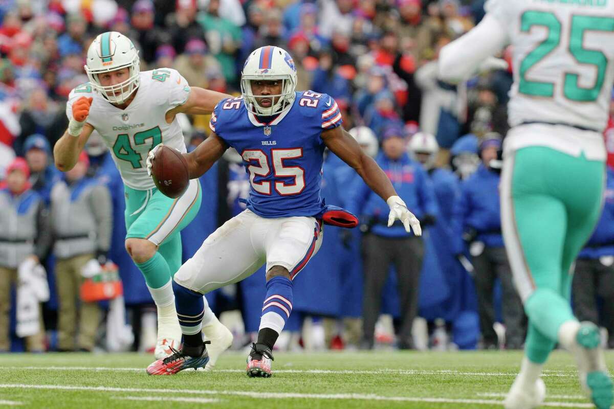 Buffalo Bills' LeSean McCoy (25) rushes past Miami Dolphins' Kiko Alonso (47) during the first half of an NFL football game Sunday, Dec. 17, 2017, in Orchard Park, N.Y. (AP Photo/Adrian Kraus) ORG XMIT: NYFF116