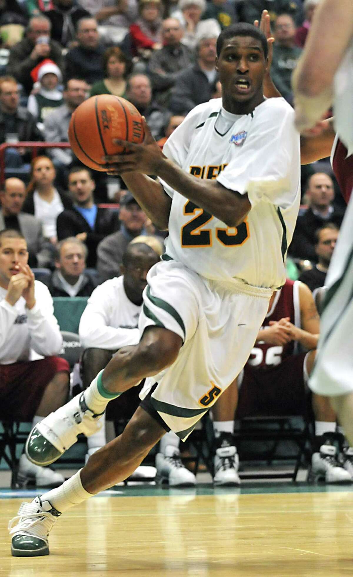 Siena's Edwin Ubiles drives to the basket during a basketball game against Rider at the Times Union Center in Albany, NY on December 23, 2009. (Lori Van Buren / Times Union)