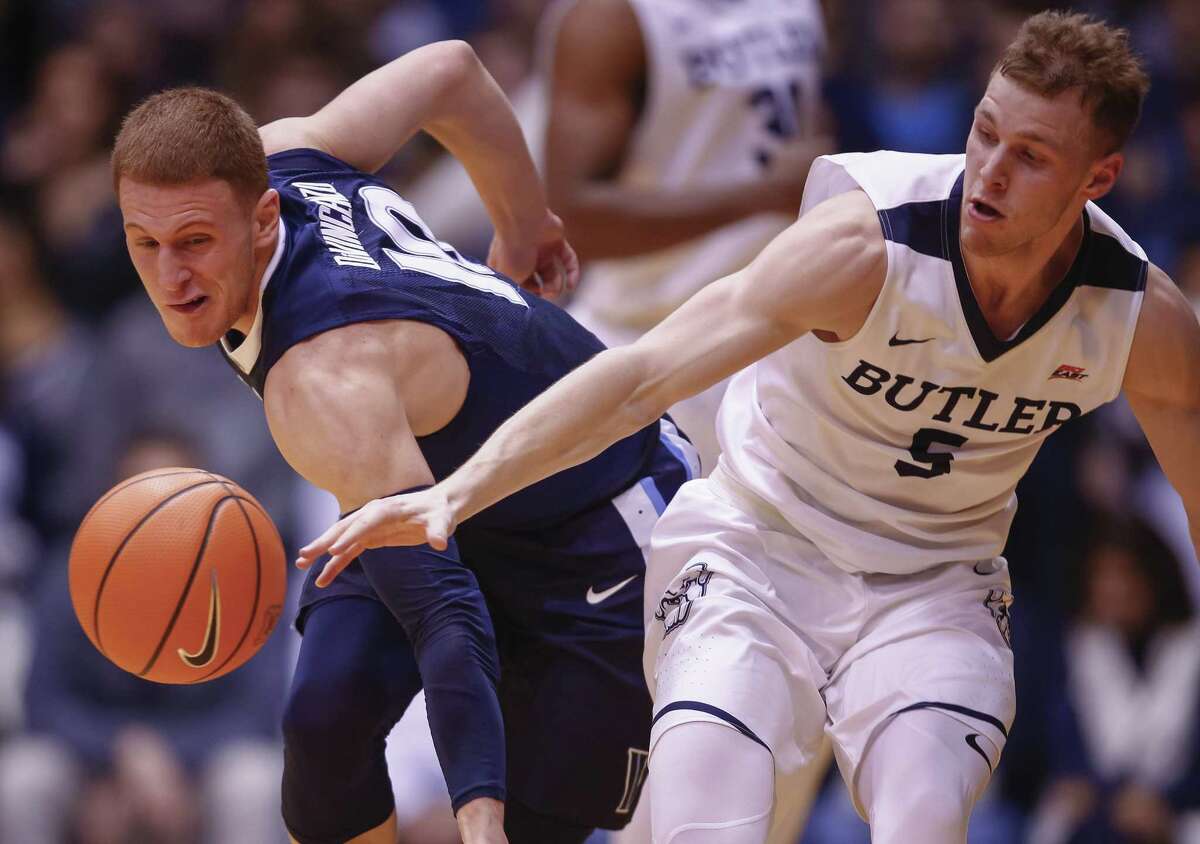 INDIANAPOLIS, IN - DECEMBER 30: Paul Jorgensen #5 of the Butler Bulldogs and Donte DiVincenzo #10 of the Villanova Wildcats battle for the ball at Hinkle Fieldhouse on December 30, 2017 in Indianapolis, Indiana. (Photo by Michael Hickey/Getty Images)