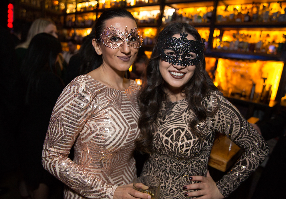 Photos Masks, mystery combine for classy New Year's Eve party at