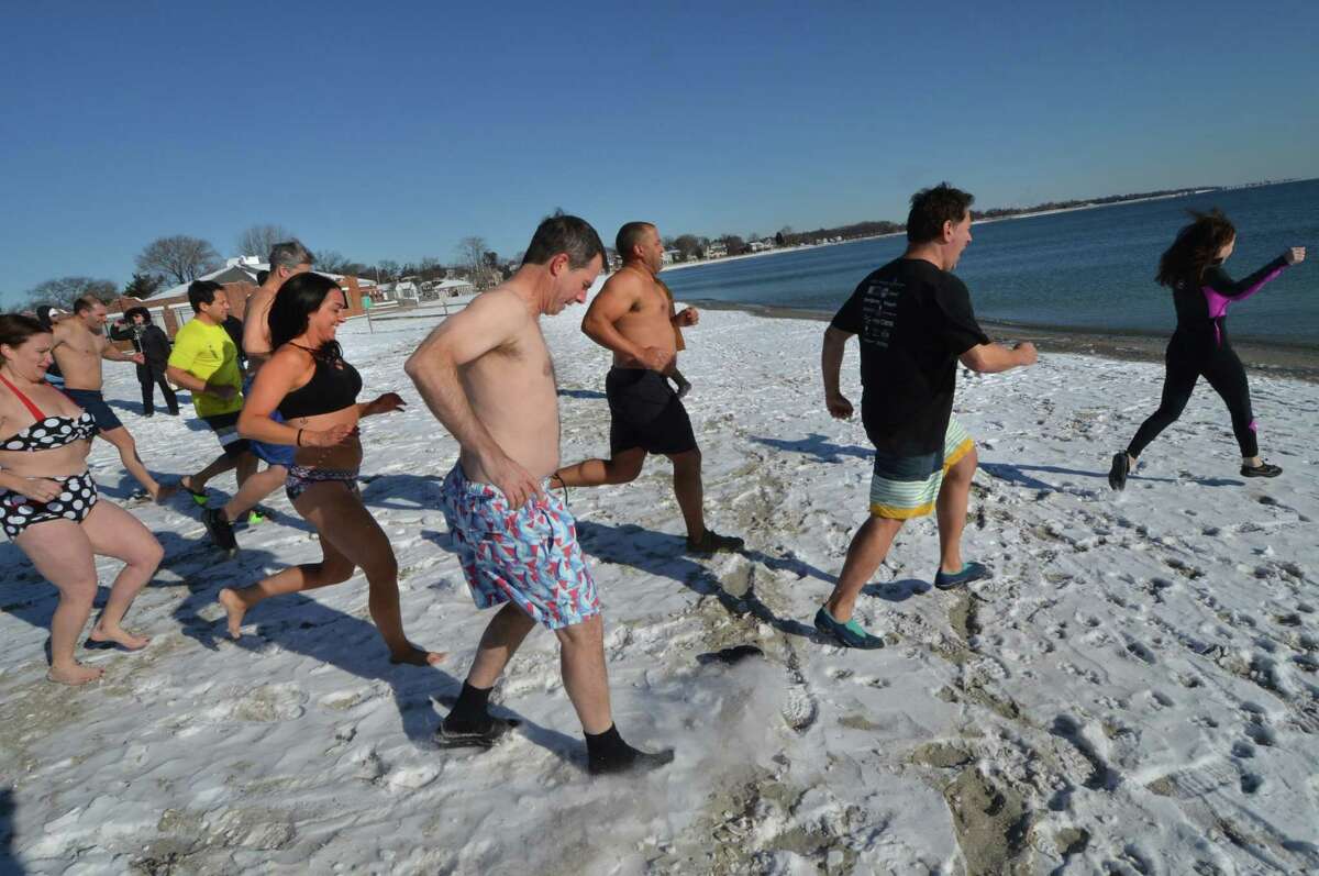 In Photos Polar Bear Plunge at Compo Beach in Westport