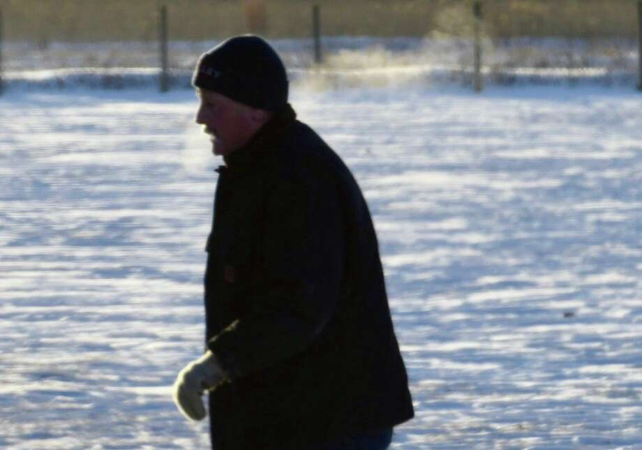A man braves the extreme cold Tuesday to get in some morning exercise in Colonie.  Photo: Skip Dickstein / Times Union