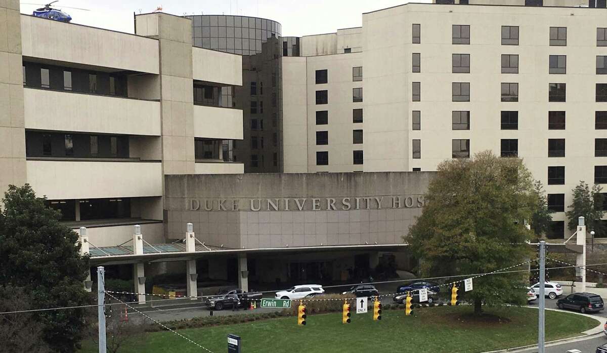 This photo taken Dec. 15, 2017, shows Duke University Hospital, which is part of the Duke University Medical Center in Durham, N.C. A federal anti-trust complaint filed by Dr. Danielle Seaman, a former radiology professor at the university claims that Duke and the nearby University of North Carolina at Chapel Hill conspired to avoid competition by agreeing not to hire talent away from each others medical enterprises. Both Duke and UNC deny the existence of the no-hire agreement.
