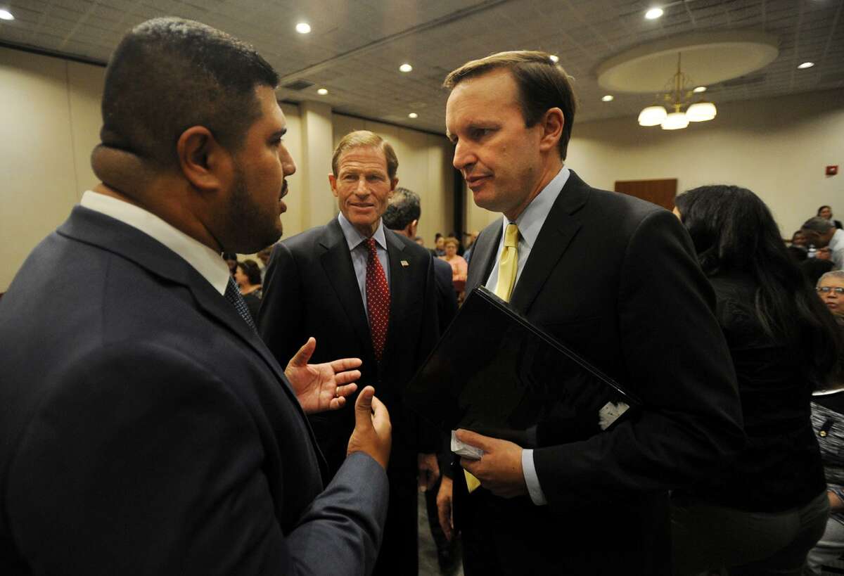From left; Bridgeport State Rep. Chris Rosario talks with Senators Richard Blumenthal and Chris Murphy at a public meeting concerning the devastation in Puerto Rico at the Margaret Morton Government Center in Bridgeport, Conn. on Wednesday, October 11, 2017.