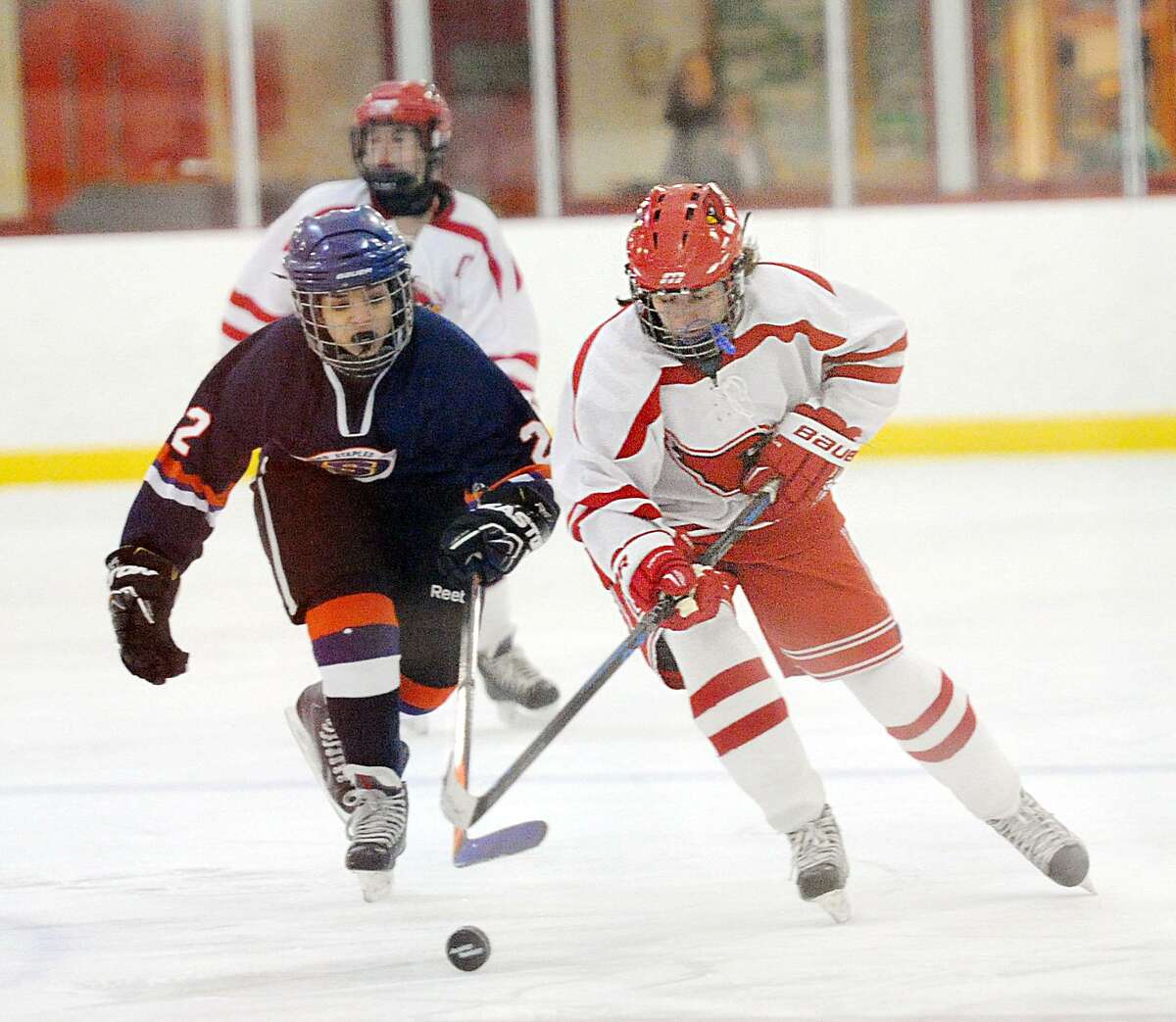 Greenwich’s Paige Finneran, right, against Kaela Shaulson of Stamford-Staples-Westhill on Tuesday at Hamill Rink in Greenwich.