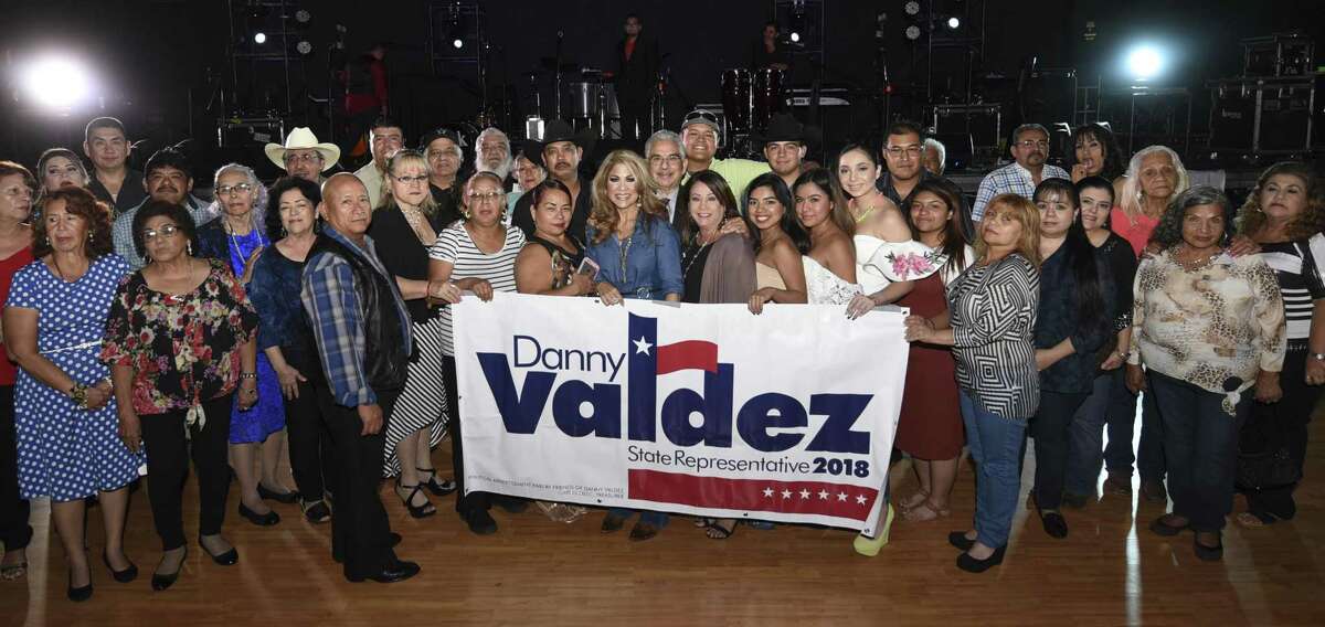 Danny Valdez poses for a photo with his banner on Friday, Oct. 6, 2017, as Valdez announces his candidacy for State Representative in 2018, at the Casablanca Ballroom.
