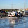 TxDOT treats the icy roadway with a brine solution outside the Louis Shanks Furniture store near Huebner Road and Interstate 10 Wednesday morning, Jan. 3, 2018. The store left its sprinklers on, causing a patch of frozen water to form on the I-10 access road after the De Zavala Road exit.