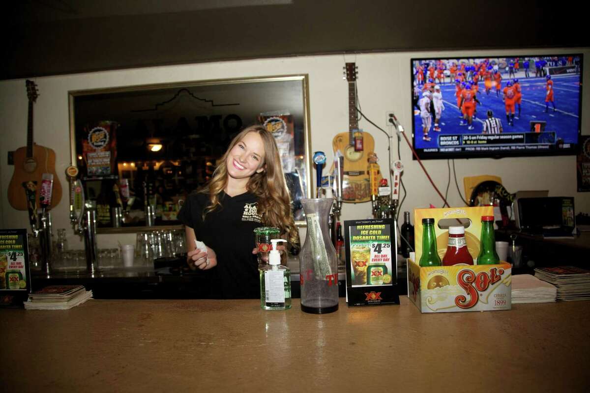 Kaitlyn Merchant is behind the bar at Alamo Ice House.