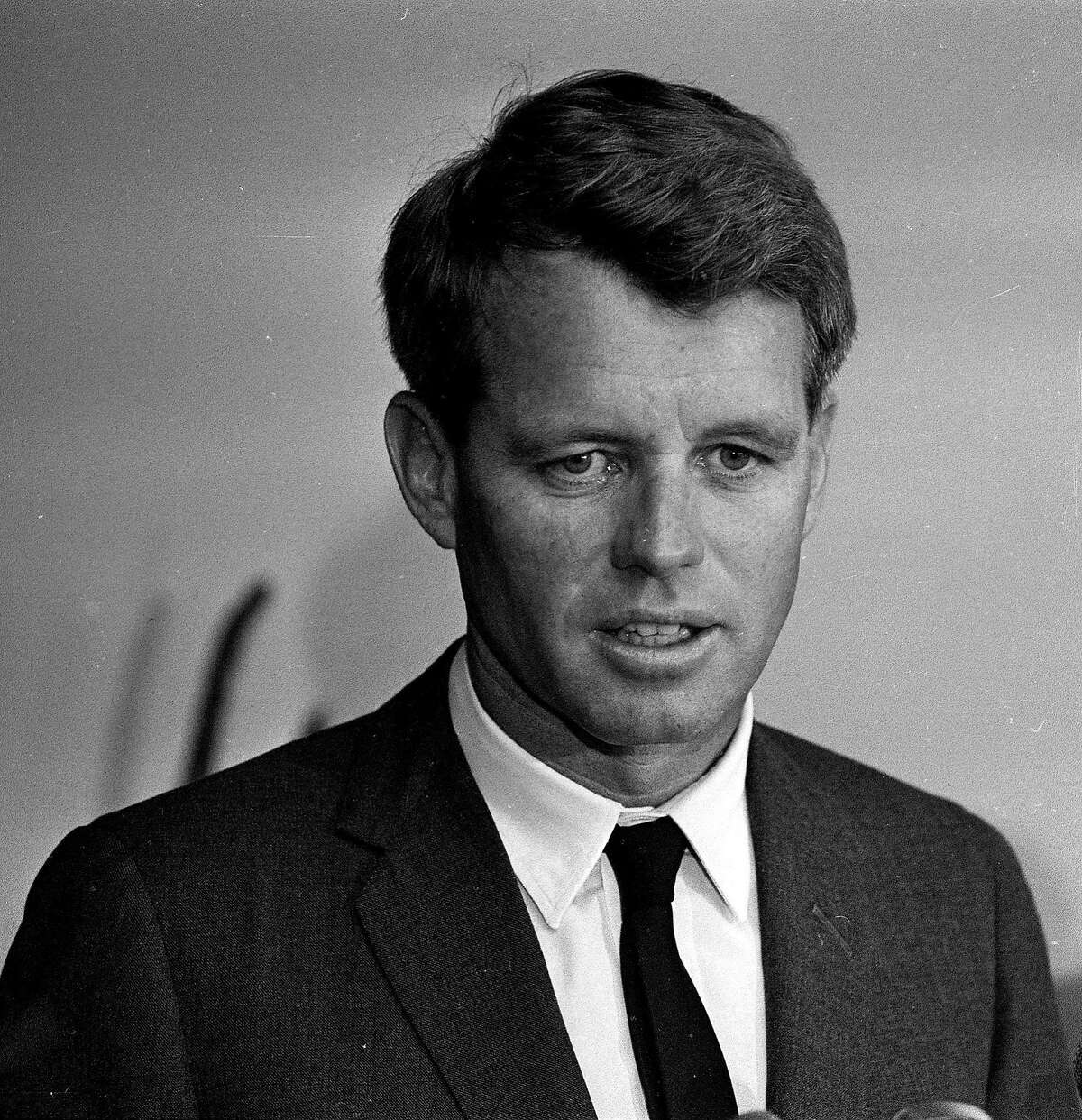 ** FILE ** U.S. Attorney Gen. Robert F. Kennedy is photographed in his office in Washington, D.C. on Aug. 28, 1964. The widow and a daughter of the late Robert F. Kennedy give a thumbs-up for "Bobby," an ensemble drama about the 1968 Kennedy assassination directed by Emilio Estevez and set for release next month.(AP File Photo)