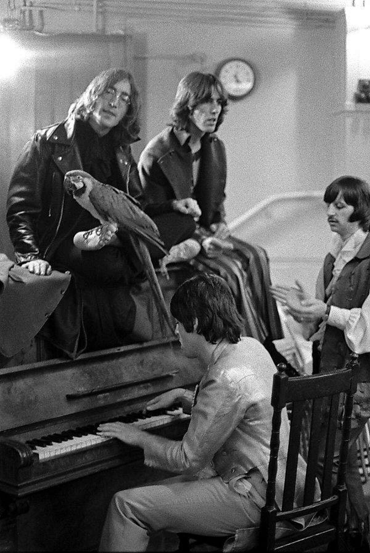 Goldblatt: "They had recently recorded �Hey Jude� and so Paul is playing �Hey Jude,� and they�re all singing, and the parrot is just a prop that Paul�s girlfriend brought along. She was the prop girl. It was taken in the Mercury Theatre in Notting Hill." Rare Beatles photos at the gallery of the UC Berkeley Graduate School of Business.
