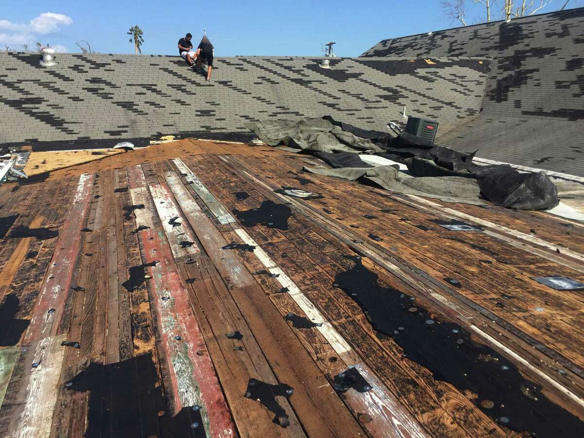 In this Aug. 30, 2017 photo, volunteers inspect damage to the roof of Rockport First Assembly of God Church in Rockport, Texas. The church, which was hit by Hurricane Harvey, has filed a lawsuit against the Federal Emergency Management Agency, challenging its policy of denying disaster aid to repair or rebuild places of worship. Places of worship are routinely denied FEMA aid when it comes time to repair and rebuild their damaged sanctuaries. (Photo Courtesy/Bruce Frazier via AP)