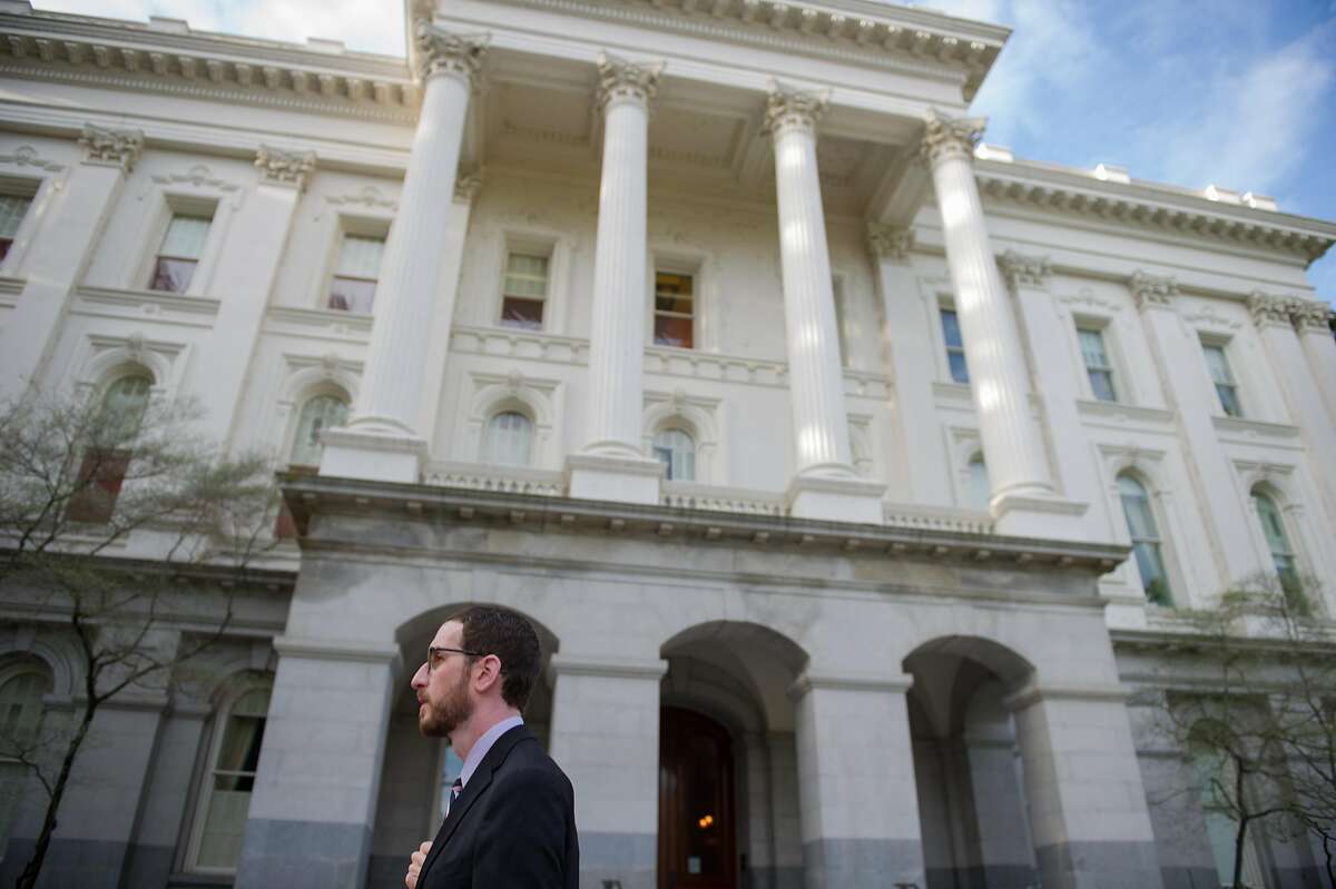 FILE-- Sen. Scott Wiener, D-San Francisco, walks to the state Capitol in Sacramento, Calif. on Thursday, March 16, 2017.